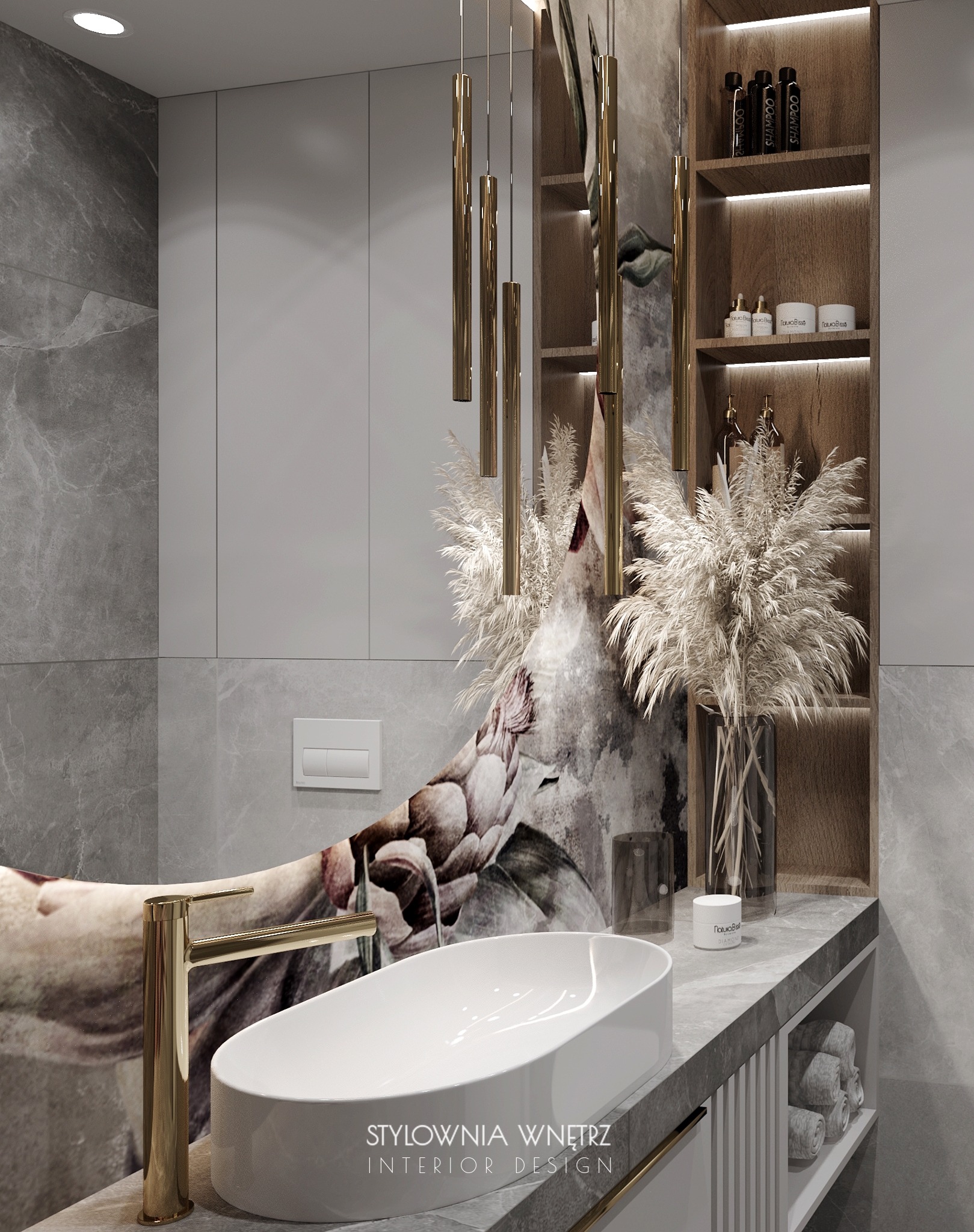 Nowoczesna łazienka z owalną umywalką nablatową, złotą baterią i dekoracyjną tapetą z motywem kwiatowym, uzupełniona o złote lampy wiszące i półki z kosmetykami.