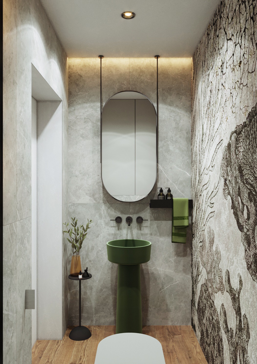 Nowoczesna łazienka z zieloną umywalką na postumencie, owalnym lustrem podwieszonym na linkach, marmurowymi ścianami i drewnianą podłogą, akcentem roślinnym w wazonie i wzorzystą tapetą.
