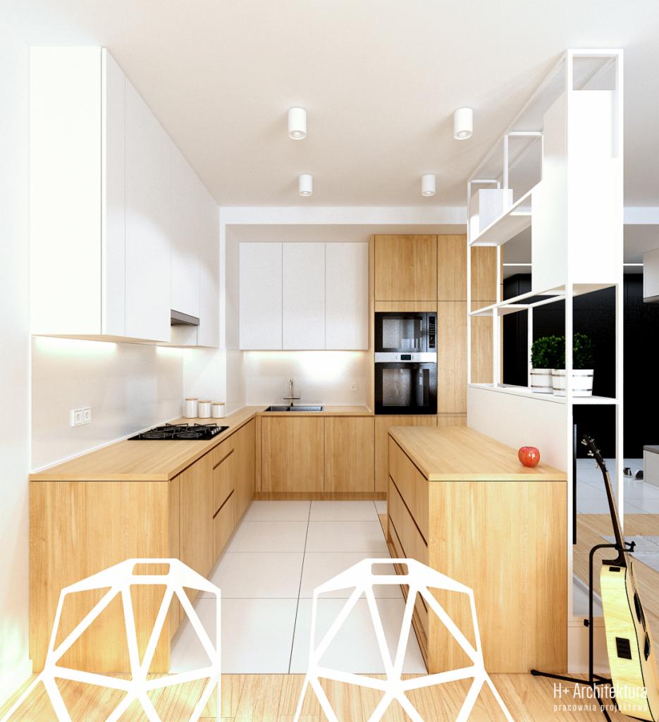 Jasna kuchnia w Lublinie z drewnianymi blatami i białymi szafkami, widziana z perspektywy dwóch nowoczesnych krzeseł, z gitarą opartą o ścianę w tle.
