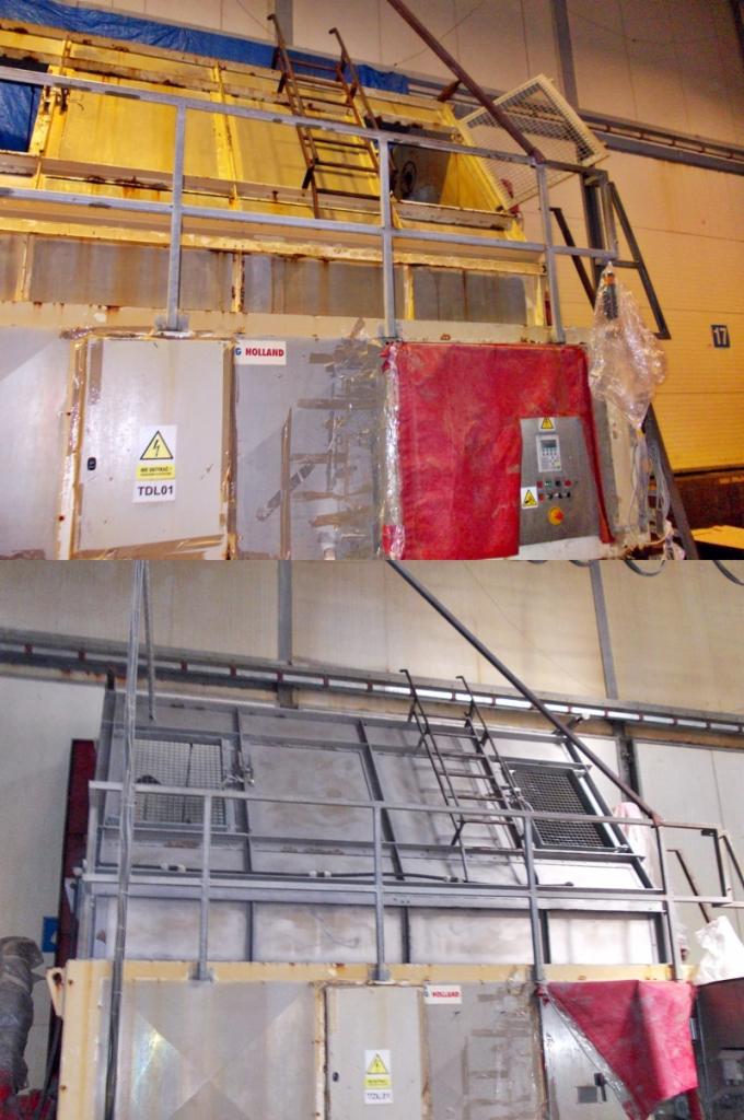 Wielkogabarytowa maszyna przemysłowa z drabinkami i metalowymi konstrukcjami. Widoczny panel sterowania i tabliczka ostrzegawcza. Elementy wymagają czyszczenia.