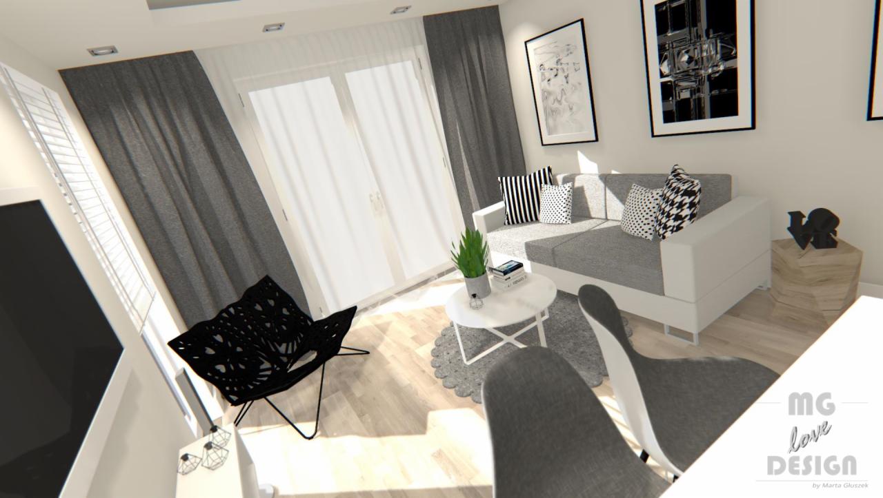 Wizualizacja salonu w odcieniach szarości i bieli z czarnymi akcentami: ażurowe krzesło, sofa z poduszkami w geometryczne wzory, okrągły stolik kawowy z rośliną doniczkową i książkami, obrazy...