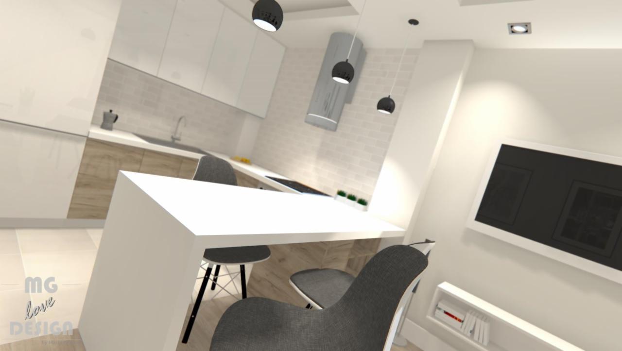 Wizualizacja wnętrza kuchni z wyspą, krzesłami w kolorze szarym, białymi szafkami i okładziną ścienną imitującą cegłę, uzupełniona o trzy czarne lampy wiszące i minimalistyczny okap.