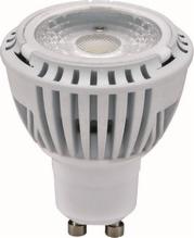 Biała żarówka LED MR16 z radiatorem, widok z bliska, skierowana w dół, z widocznymi metalowymi pinami. Nowoczesne oświetlenie energooszczędne.