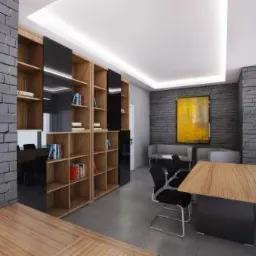 Wnętrze biura: regały z książkami, czarne fronty, drewniane półki, szara cegła na ścianach, abstrakcyjny obraz w złotej ramie, minimalistyczny design.