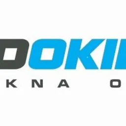 Logo firmy 'SKLADOKIEN.PL' z hasłem 'NOWE OKNA OD RĘKI' w kolorach szarym i błękitnym.