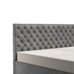 Design 4 Beds Sp. zo.o. - Szary, tapicerowany zagłówek łóżka z pikowaniem w romby oraz fragment materaca, prezentacja mebla z Wiązowny.