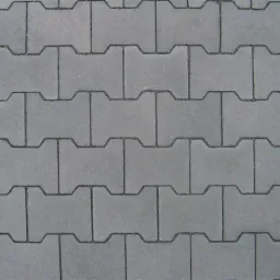 Szara kostka brukowa typu I ułożona w regularny wzór. Widok z góry, równomierne oświetlenie, brak widocznych zabrudzeń.