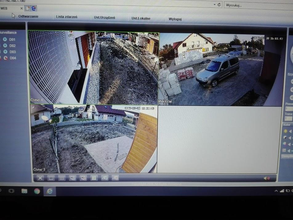Ekran monitora z widokiem z czterech kamer monitoringu: ogród, podjazd z samochodem, plac budowy, elewacja budynku.