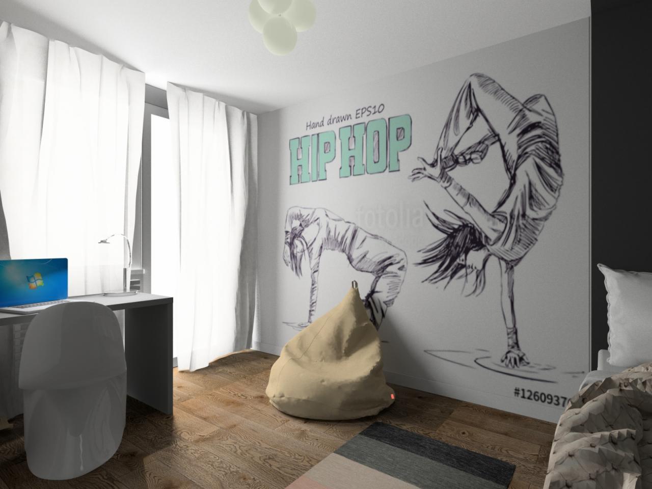 Pokój z rysunkami tancerzy hip-hop na ścianie, beżowy puf, biurko z laptopem i drewniana podłoga.