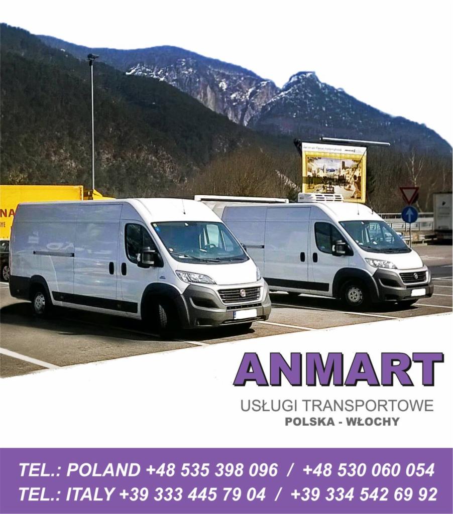 Dwa białe busy firmy ANMART na parkingu z widokiem na góry. Usługi transportowe Polska-Włochy, numery telefonów.