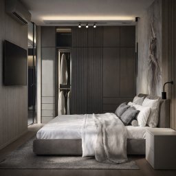 montom - Nowoczesna sypialnia w stonowanej kolorystyce: szarości i biele. Duże łóżko z miękkim pledem, szafa w zabudowie z oświetleniem punktowym, minimalistyczna lampka nocna.