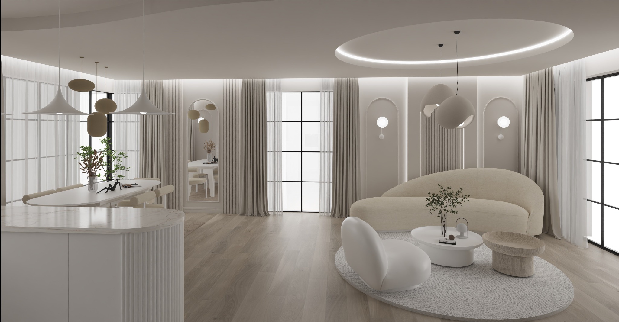 Jasne, przestronne wnętrze w neutralnej kolorystyce. Widoczny salon z sofą o obłych kształtach, stolikiem kawowym oraz jadalnia z długim stołem i krzesłami. Całość doświetlona naturalnym światłem.