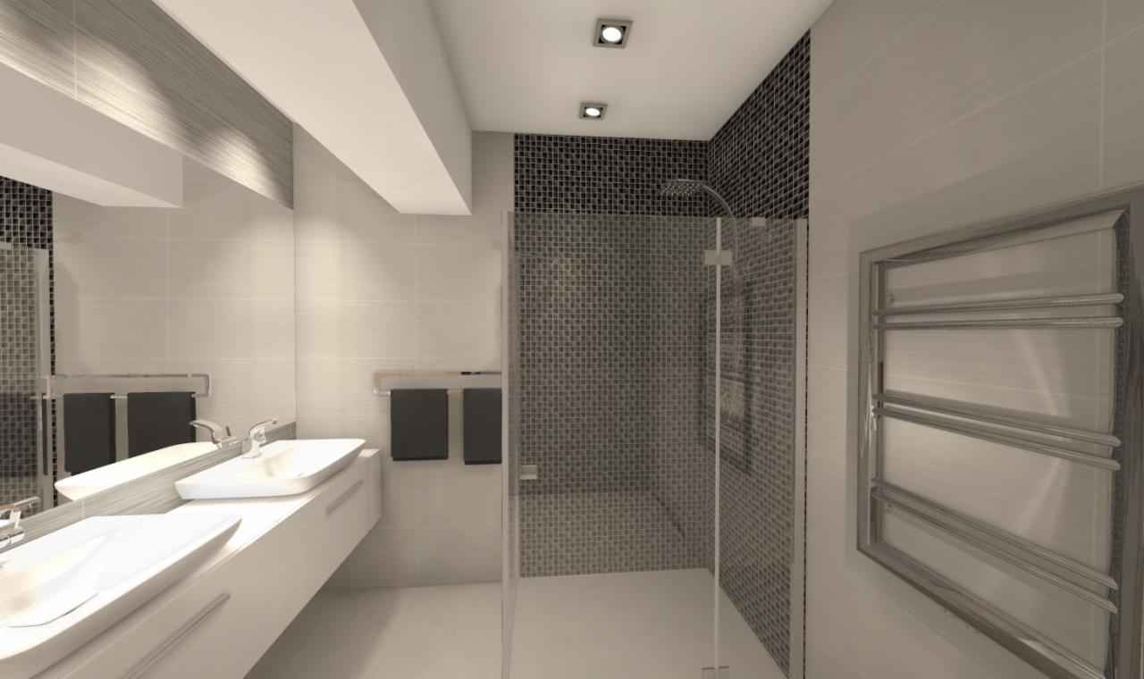 Nowoczesna łazienka z kabiną prysznicową wyłożoną mozaiką, podwójną umywalką na białym blacie i grzejnikiem drabinkowym w chromowanej ramie.