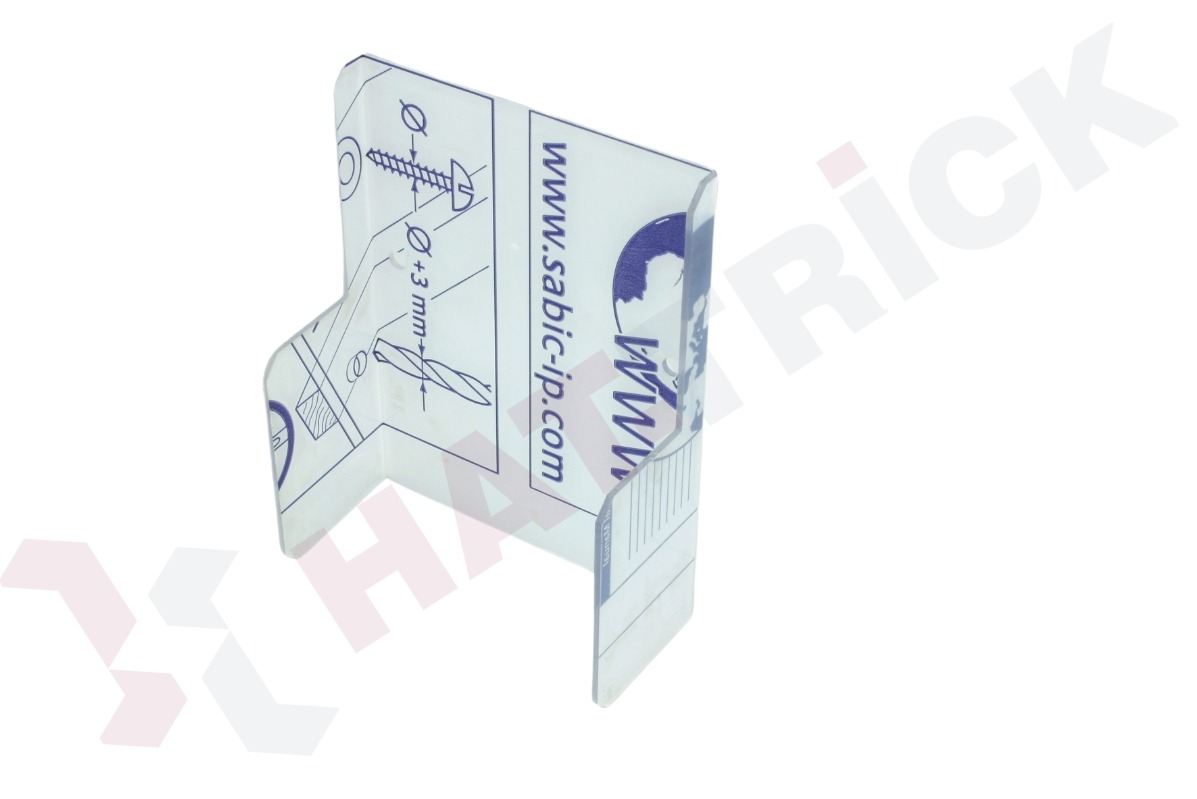 Przezroczysta, plastikowa naklejka z instrukcją montażu, widoczne schematy wiercenia i wkręcania, logo i adres strony internetowej. Naklejka w kształcie litery U.