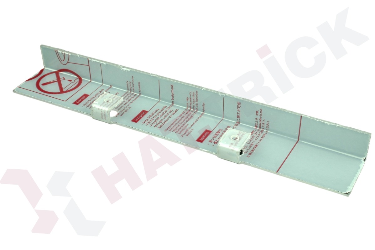 Kątownik z nadrukowanymi instrukcjami w różnych językach, zabezpieczony folią. Widoczne symbole i teksty w języku niemieckim, węgierskim i japońskim.
