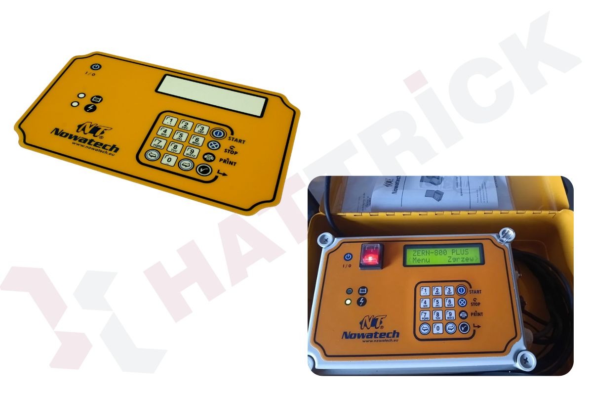 Żółta naklejka z klawiaturą numeryczną i logo Nowatech, widoczna obok urządzenia z wyświetlaczem i podobną naklejką, całość w żółtej obudowie.