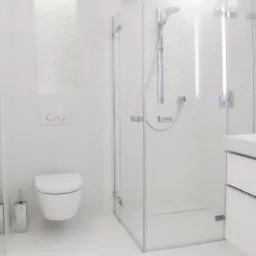 Minimalistyczna, biała łazienka z kabiną prysznicową i podwieszaną toaletą. Ściany zdobią tr&oacute;jwymiarowe płytki. Oświetlenie LED podkreśla nowoczesny charakter.