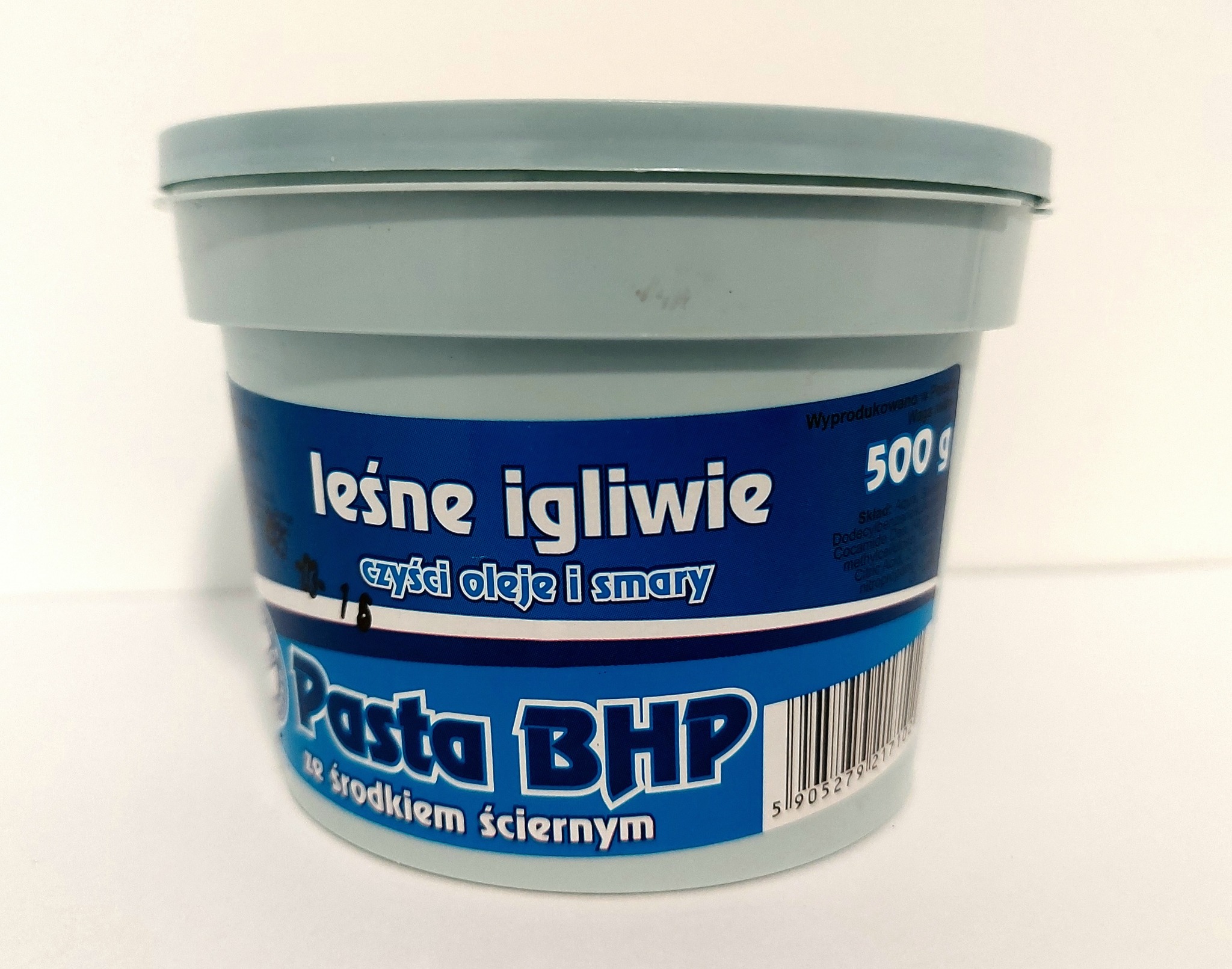 Pojemnik z pastą BHP 'Leśne Igliwie' do czyszczenia olejów i smarów, waga 500g, na białym tle.