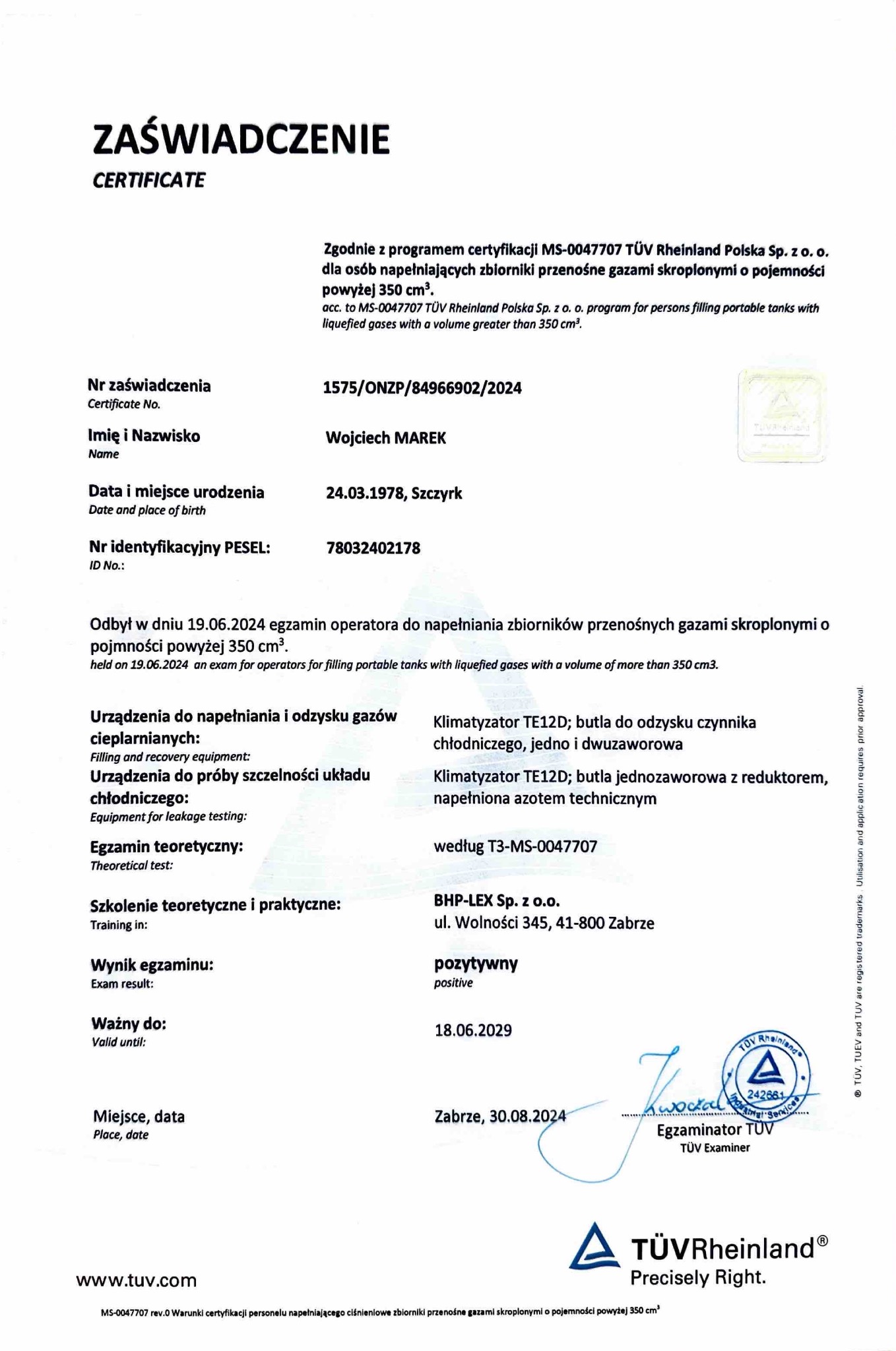 Skan certyfikatu TÜV Rheinland Polska Sp. z o.o. dla Wojciecha Marka, potwierdzający pozytywny wynik egzaminu operatora napełniającego zbiorniki przenośne gazami skroplonymi, ważny do 18.06.2029.