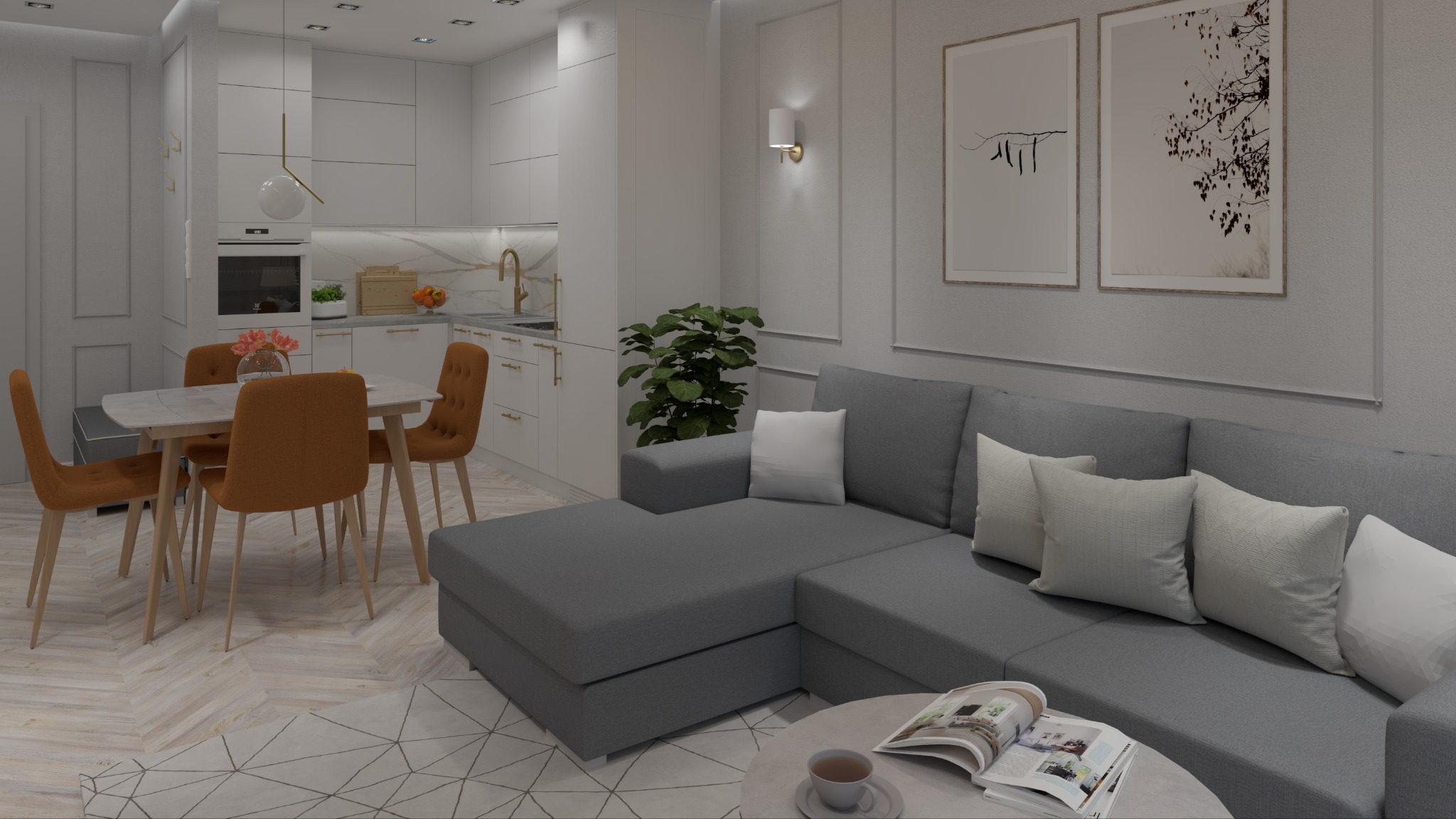 Wnętrze kawalerki: szara sofa narożna, stół z pomarańczowymi krzesłami i aneks kuchenny w bieli. Na ścianie grafiki w ramkach, parkiet w jodełkę.