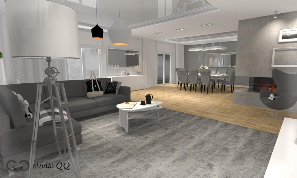 Wizualizacja salonu z szarą sofą, dywanem i kominkiem. Nad sofą lampy wiszące, obok stolik kawowy. W tle jadalnia i dekoracje ścienne. Nowoczesny design.