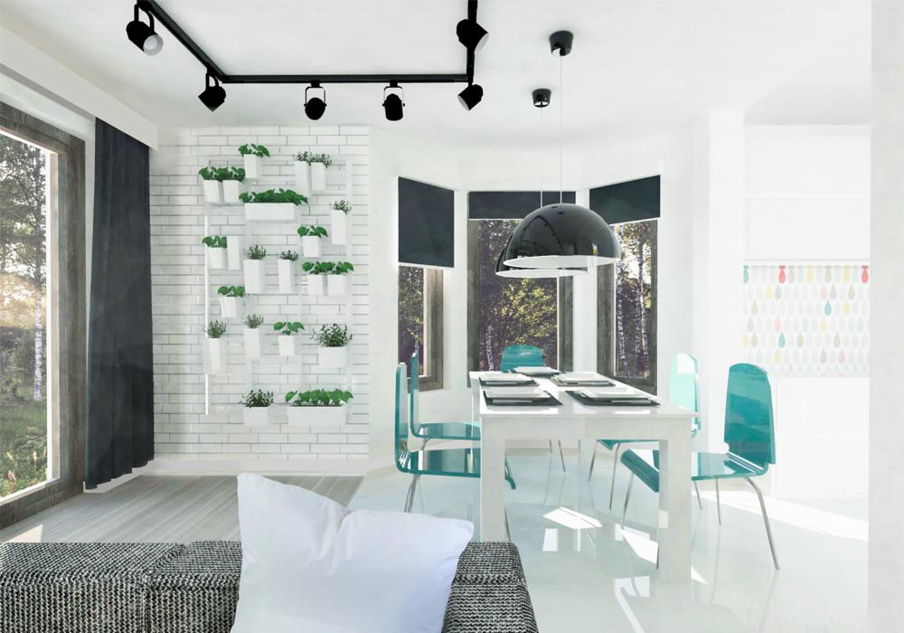 Jasna jadalnia z białym stołem, turkusowymi krzesłami, ścianą z cegły z roślinami w białych doniczkach i czarną lampą wiszącą. W tle widok na las przez okna.