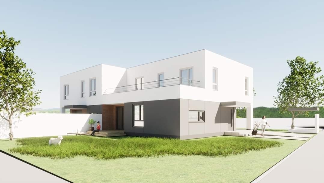 Wizualizacja nowoczesnego, dwukondygnacyjnego domu z płaskim dachem, białymi ścianami i szarym cokołem. Na trawniku siedzi osoba, obok biega biały pies.