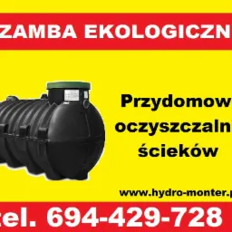 Grafika reklamowa: czarny zbiornik ekologicznej oczyszczalni ścieków na żółtym tle z czerwonymi napisami 'Szamba ekologiczne' oraz numerem telefonu i adresem strony internetowej.