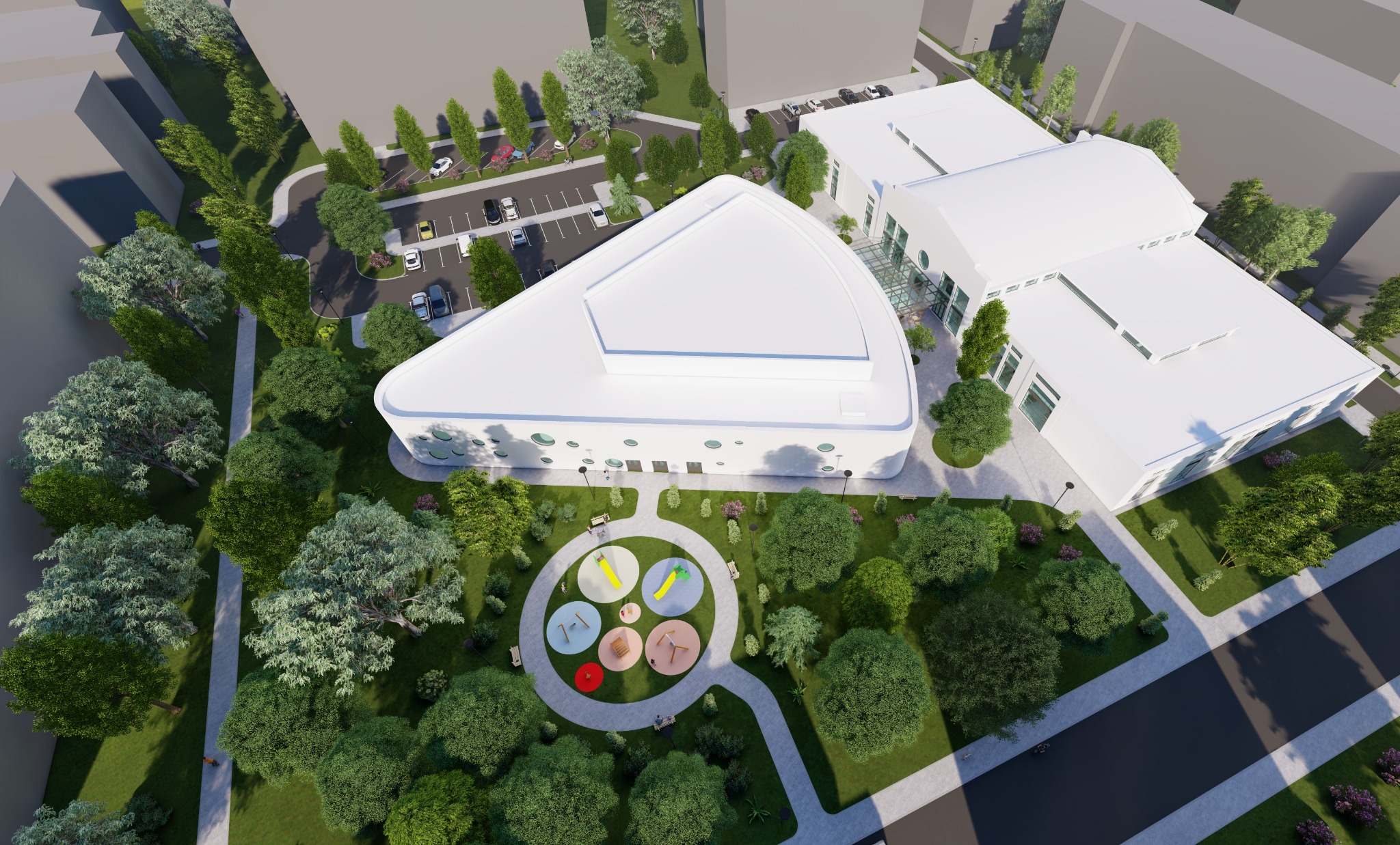 Wizualizacja z lotu ptaka nowoczesnego budynku usługowego z zaokrąglonymi elementami, otoczonego zielenią, parkingiem i placem zabaw.