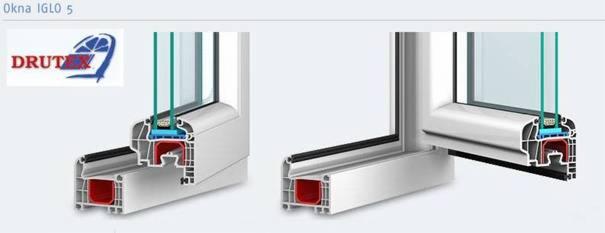 Przekrój okna IGLO 5 z szybą, prezentujący detale konstrukcyjne i materiały. Widoczne uszczelki, komory powietrzne i elementy mocujące. Profil okienny w kolorze białym.