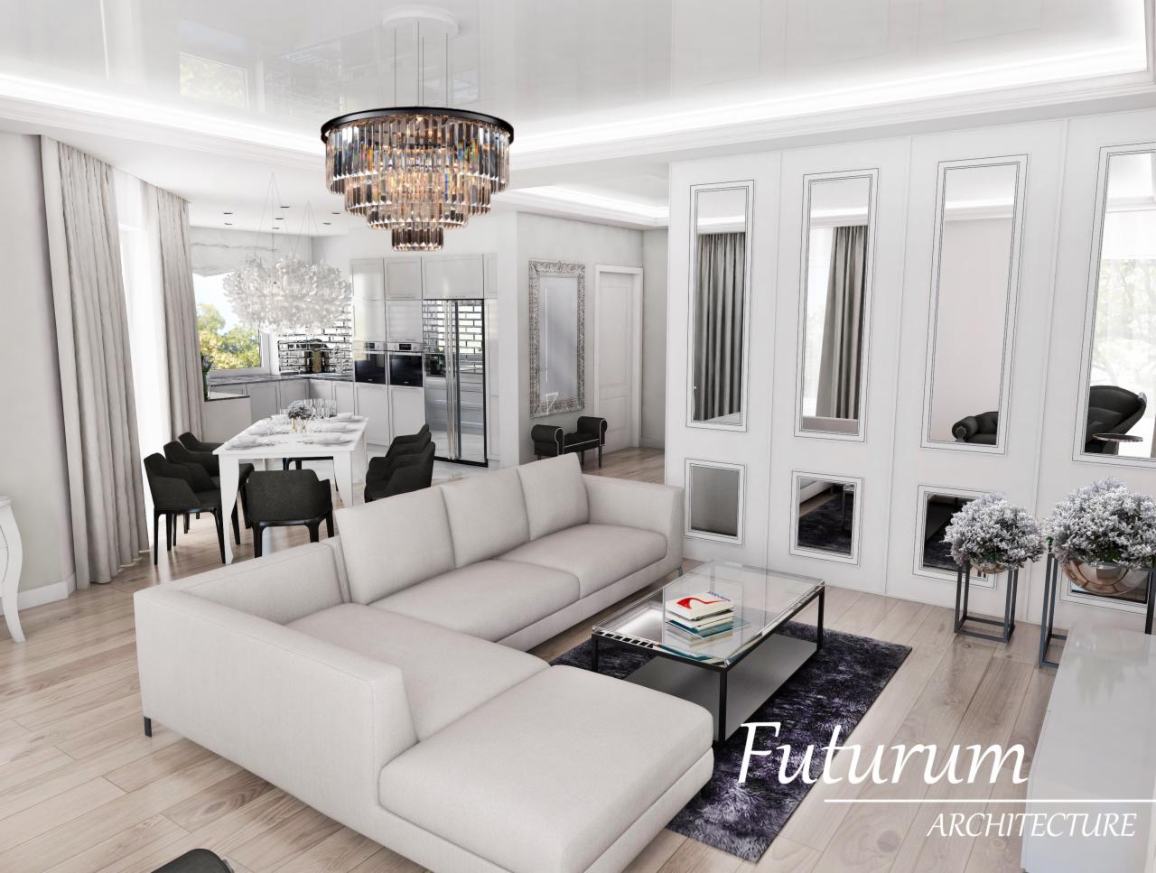 Elegancki salon z narożnikiem, kryształowym żyrandolem i dekoracyjną ścianą z lustrami. Jasne wnętrze z drewnianą podłogą i widokiem na jadalnię.