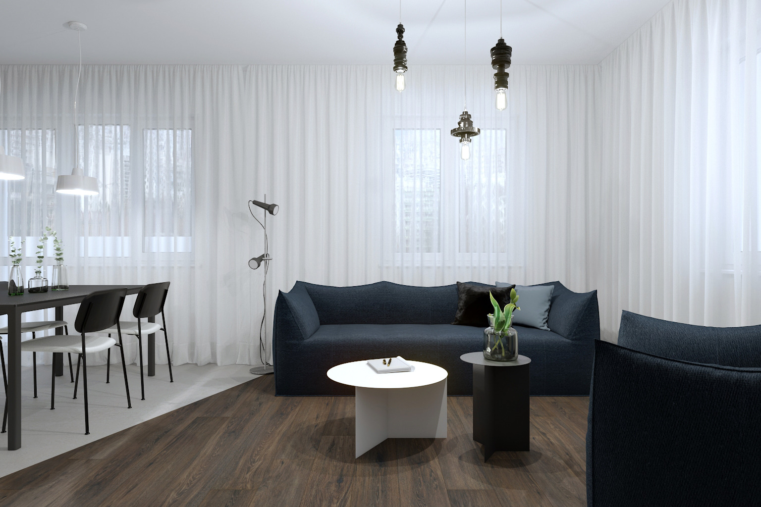 Nowoczesny salon z ciemnoniebieską sofą modułową, okrągłymi stolikami kawowymi w bieli i czerni, drewnianą podłogą i białymi zasłonami.