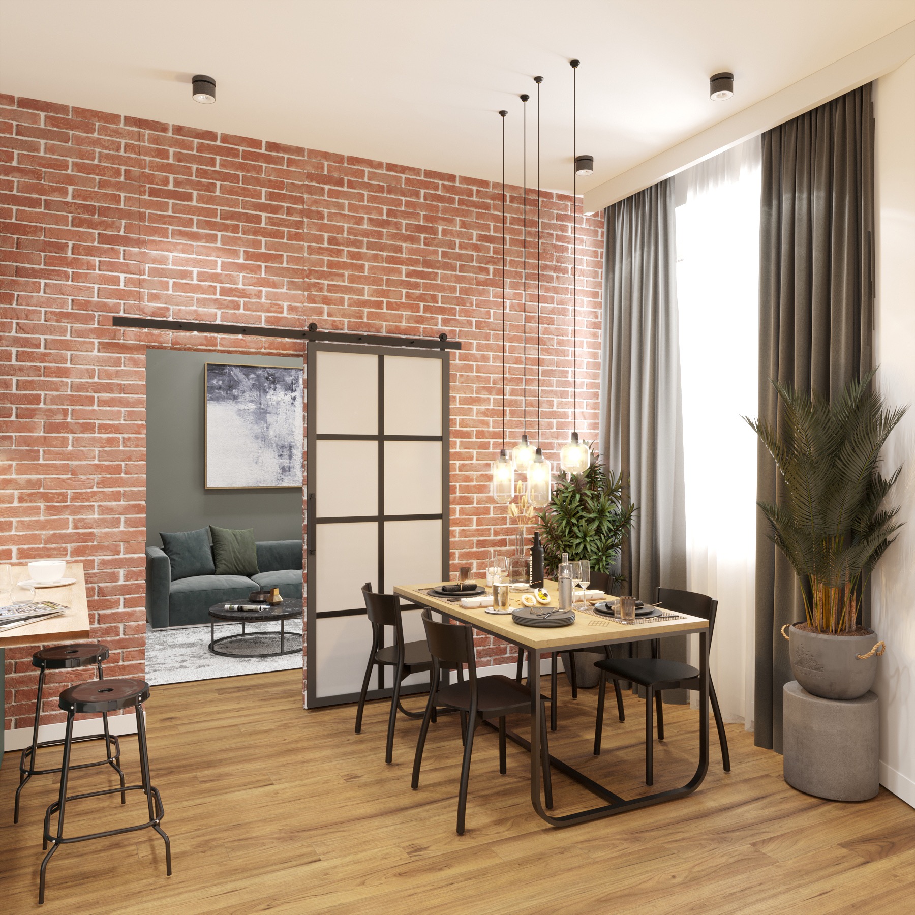 Jadalnia w stylu loft z ceglaną ścianą, drewnianą podłogą i stołem z czarnymi krzesłami. W tle widoczny salon z szarą sofą i abstrakcyjnym obrazem, oddzielony przesuwnymi drzwiami w metalowej ramie.
