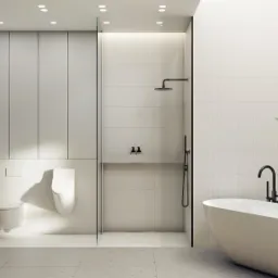 Minimalistyczna łazienka w odcieniach bieli i szarości z wolnostojącą wanną, kabiną prysznicową oddzieloną szklaną ścianką i roślinami doniczkowymi.