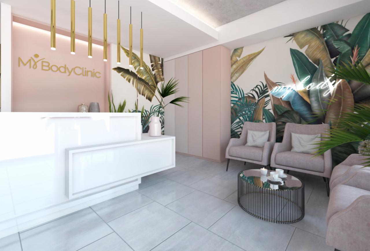 Nowoczesne wnętrze recepcji kliniki z białym biurkiem, złotymi lampami wiszącymi, ścianą z motywem tropikalnych liści i neonem, oraz strefą oczekiwania z fotelami i stolikiem kawowym.
