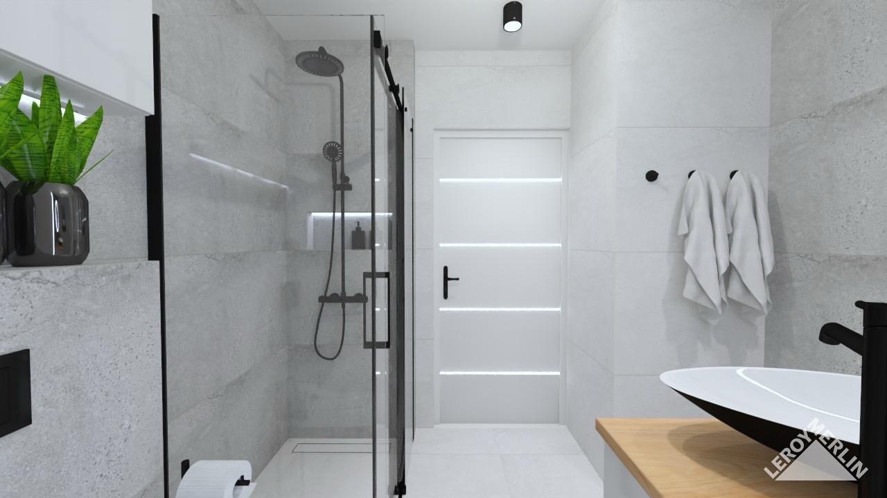 Wizualizacja nowoczesnej łazienki z kabiną prysznicową typu walk-in z czarnymi elementami, umywalką nablatową na drewnianym blacie i szarymi płytkami imitującymi kamień.