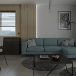 Wnętrze mieszkania z turkusową sofą narożną, czarnym stolikiem kawowym z dekoracjami, szarą podłogą i krzesłami przy drewnianym stole, uzupełnione czarną komodą i oświetlone lampą podłogową.