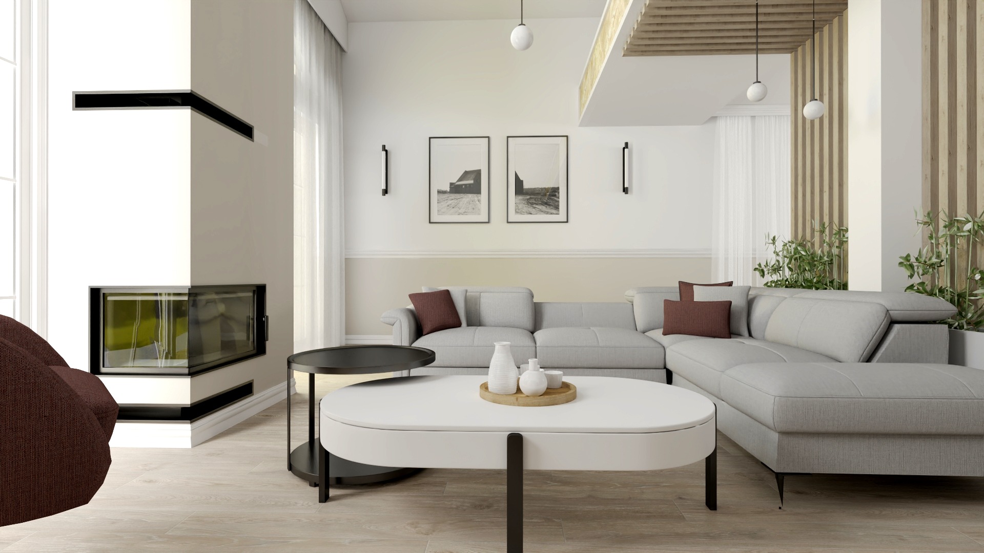 Jasne wnętrze salonu z narożną sofą, kominkiem z czarnymi akcentami, dwiema okrągłymi ławami i dekoracjami ściennymi w postaci obrazów i kinkietów.