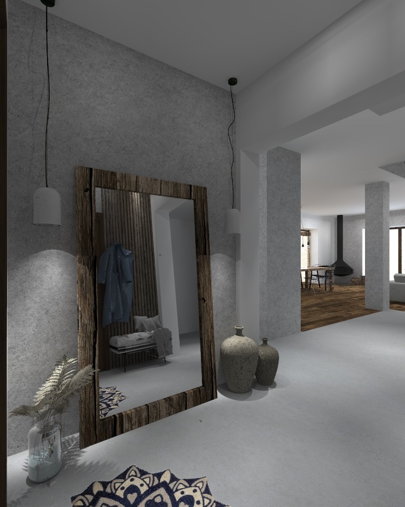 Wnętrze przedpokoju z dużym lustrem w drewnianej ramie, odbijającym minimalistyczną ławkę i wieszak na ubrania. Obok lustra ceramiczne wazony, a na podłodze dywan z wzorem. W tle widoczny salon...