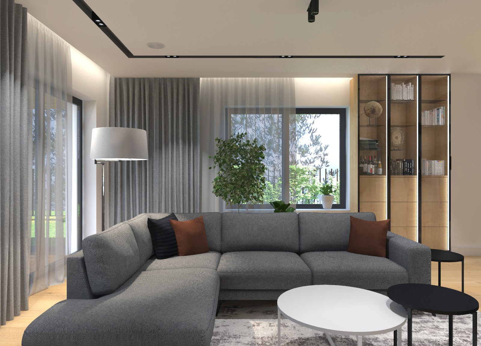 Nowoczesny salon z szarą sofą narożną, okrągłymi stolikami kawowymi i regałem z oświetleniem LED, widok na zieleń za oknem.