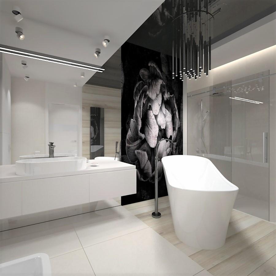 Nowoczesna łazienka w bieli i czerni z wolnostojącą wanną, minimalistyczną umywalką, przeszkloną kabiną prysznicową i dekoracyjną tapetą z motywem kwiatowym oraz wiszącą lampą z metalowych prętów.