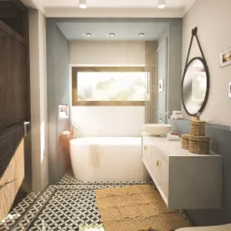 Nowoczesna łazienka z owalną wanną, umywalką nablatową i okrągłym lustrem wiszącym na ścianie w kolorze gołębiej szarości, wzorzysta podłoga i plecione koszyki na blacie.