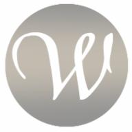 Litera 'W' w stylu kaligraficznym na szarym tle w kształcie okręgu, prawdopodobnie logo firmy.