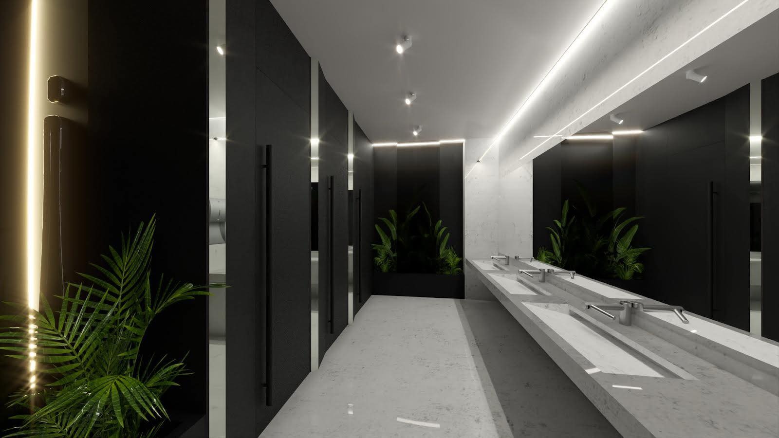 Nowoczesna łazienka publiczna z długim, dzielonym blatem umywalkowym, czarnymi ścianami, roślinami doniczkowymi i oświetleniem LED.