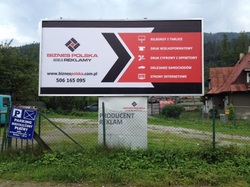 Billboard reklamowy firmy 'Biznes Polska Agencja Reklamy' prezentujący usługi: bilbordy i tablice, druk wielkoformatowy, druk cyfrowy i offsetowy, strony internetowe, z widoczną informacją...