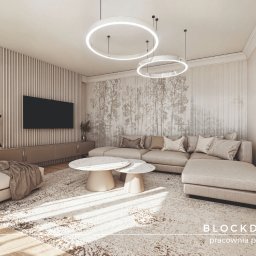 Strefa dzienna w apartamencie - wnętrze w odcieniach bieli z jasnym drewnem. Projekt wykonany przez Pracownia Projektowa BLOCKDESIGN.