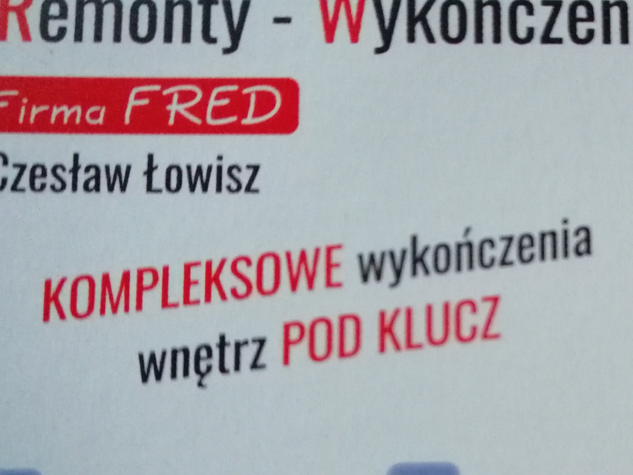 Fragment wizytówki firmy 'FRED' Czesław Łowisz, oferującej kompleksowe wykończenia wnętrz pod klucz, z wyraźnie zaznaczonymi słowami 'Remonty - Wykończenia'.