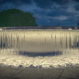 Oświetlona, okrągła fontanna kaskadowa z białych kamieni na ciemnym tle nieba i zieleni.