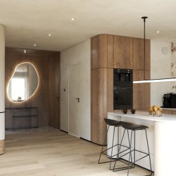 AFD Pracownia Projektowa - Nowoczesna kuchnia z wyspą i hokerami, drewniane szafki, marmurowy backsplash, designerskie oświetlenie i lustro z podświetleniem w przedpokoju.