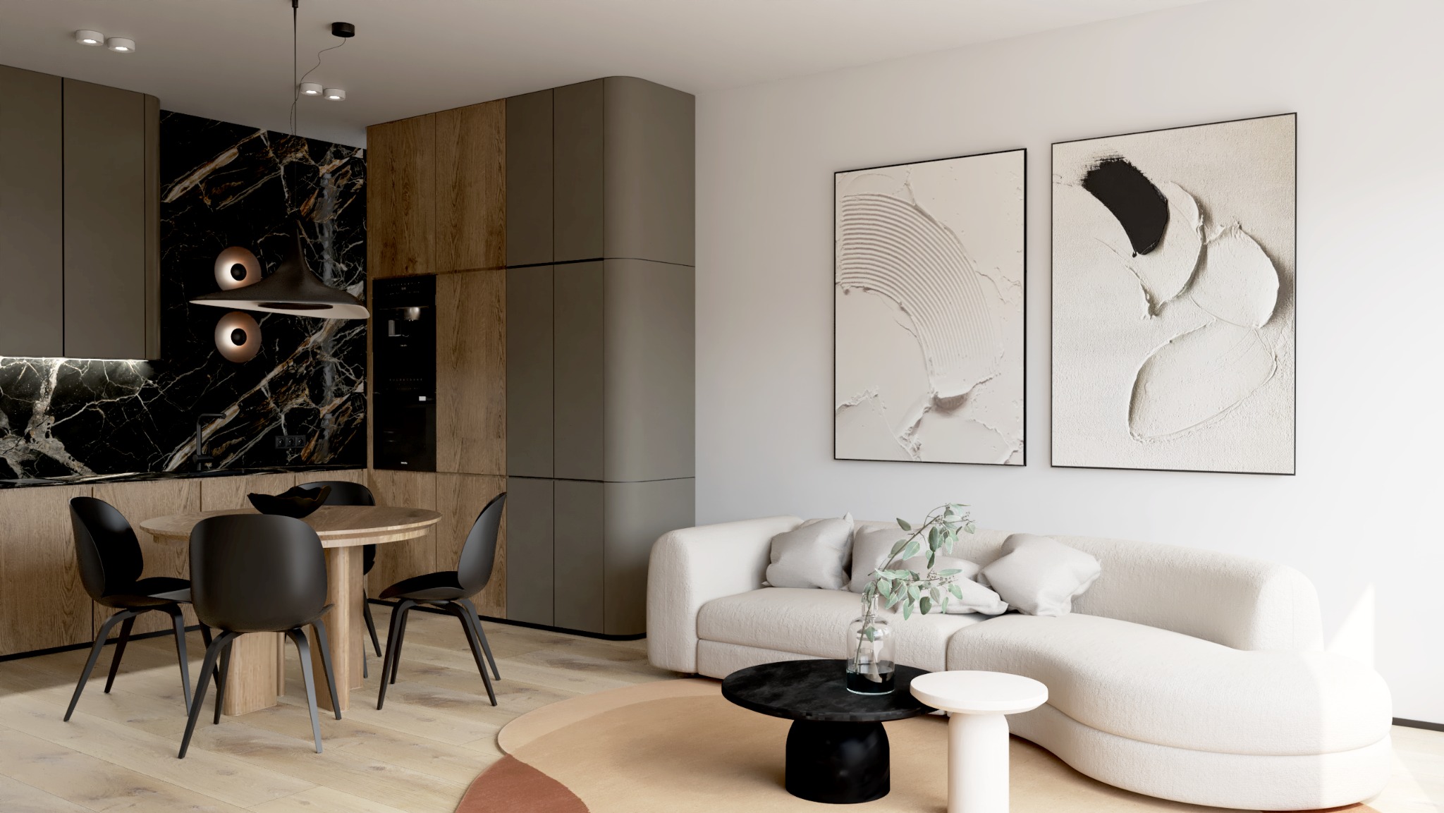 Nowoczesne wnętrze z aneksem kuchennym i wygodną sofą w Rumi. Czarno-białe obrazy na ścianie dodają elegancji. Minimalistyczny design i funkcjonalność.